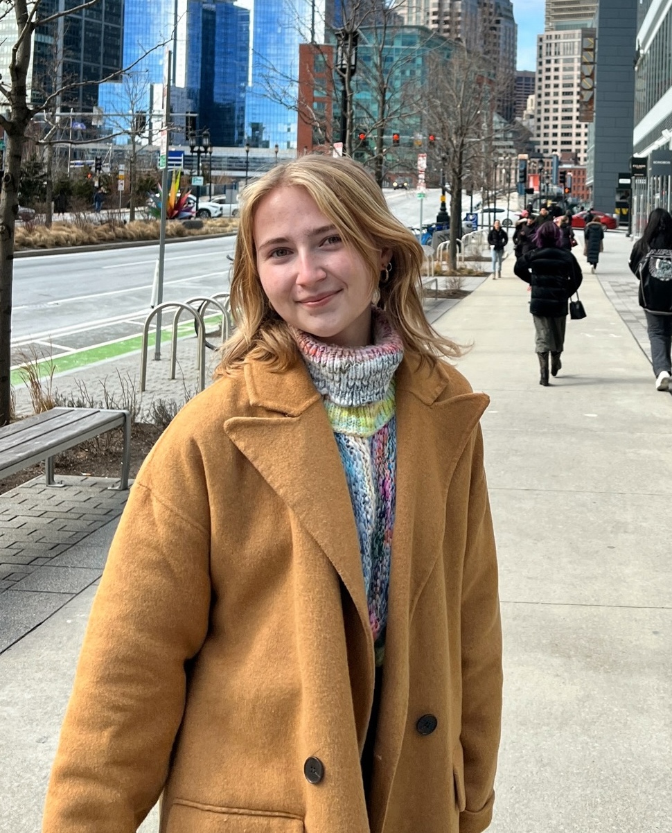 Alex Hogue smiling on the streets of Boston